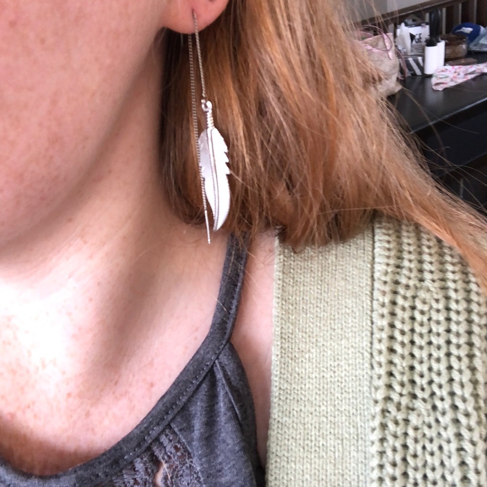 Silver tone feather earrings